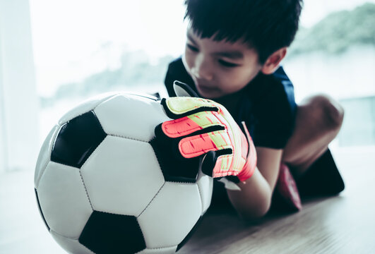 Kid Soccer Goalkeeper Hand Is Catching A Football Closed Up Shot.