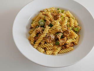 Pasta with Meatball, Green Pepper, Parsley and Provolone Cheese in a Flat White Bowl
