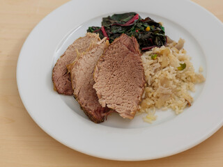 Roasted Pork Shoulder with Rice, Chard, and Nuts