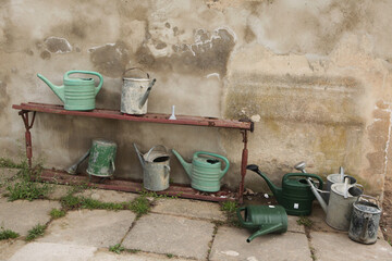Watering cans at the town cemetery in Terezin.