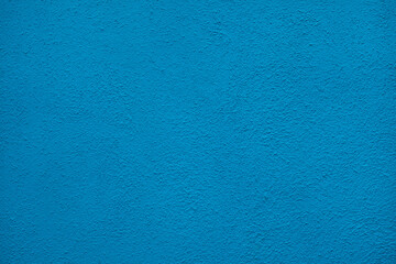 Fototapeta na wymiar Blue painted stucco wall. Background texture.