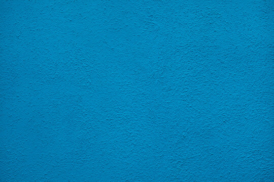 Blue painted stucco wall. Background texture.