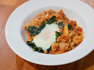 Turkey sloppy joes with shirred egg and kale