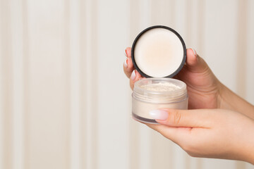 Female hand holding mineral powder