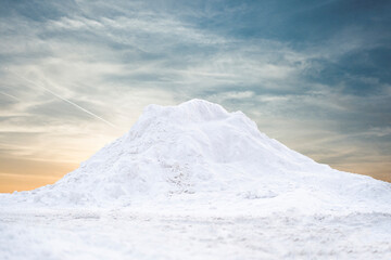 large pile of snow in the street near road, winter season