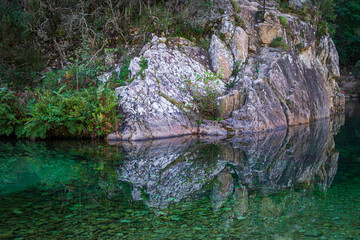 Rock formation and reflection in Solenzara River, Corsica, France