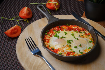 Omelet with tamat in a pan