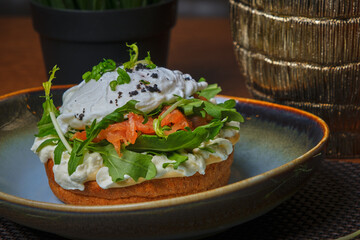 salmon and sandwich with poached egg on plate