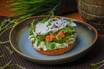 salmon and sandwich with poached egg on plate