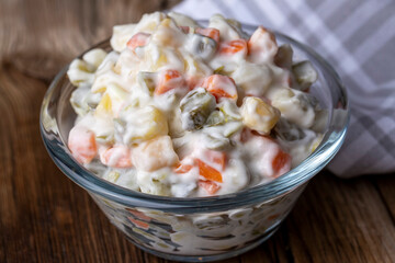 Russian salad Olivier with mayonnaise and egg served