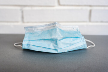 Clean medical mask on table