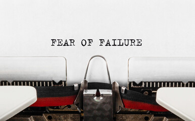 Text FEAR OF FAILURE typed on retro typewriter