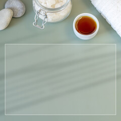 Skin care and spa relax treatment concept, flat lay composition with natural cosmetic products, stones and towel. Preparation for a relaxing massage procedure Wellness spa background, square banner