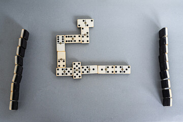 Game of dominoes on gray table