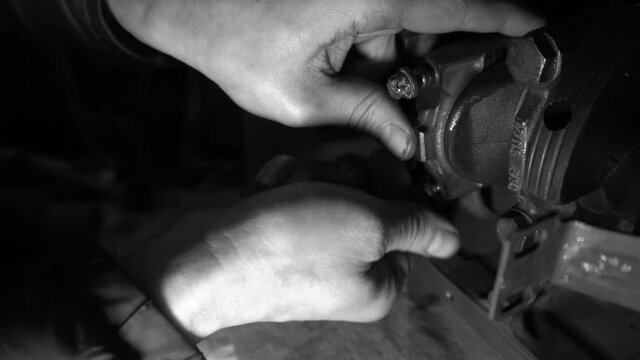 repair and tuning of an automobile engine welding work with a grinder and installation of new parts