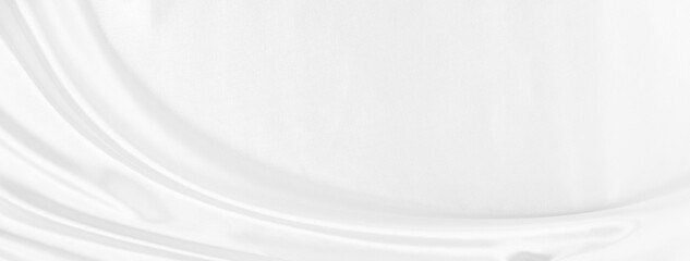 White gray satin texture that is white silver fabric silk panorama background with beautiful soft blur pattern natural.