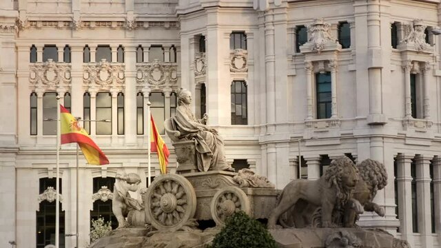 Cibeles Fountain At Plaza De Cibeles In Madrid, Spain, Europe In the evening. Tracking shot 