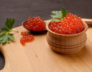 red chum salmon caviar in a wooden bowl, delicious and healthy food