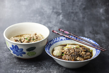 Thai boat noodles is Thailand's most famous noodles soup,Thai Boat noodles soup or Guay tiew reua ,Rice noodles thicken soup with stewed pork and pork ball, Braised pork and liver pork, 