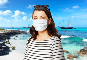 Traveling to a sunny destination during the corona or covid pandemic: tourist with sunglasses and...