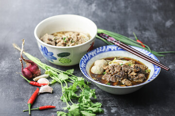 Thai boat noodles is Thailand's most famous noodles soup,Thai Boat noodles soup or Guay tiew reua ,Rice noodles thicken soup with stewed pork and pork ball, Braised pork and liver pork, 