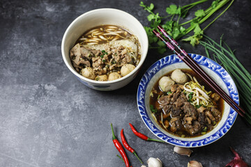 Thai boat noodles is Thailand's most famous noodles soup,Thai Boat noodles soup or Guay tiew reua ,Rice noodles thicken soup with stewed pork and pork ball, Braised pork and liver pork, 