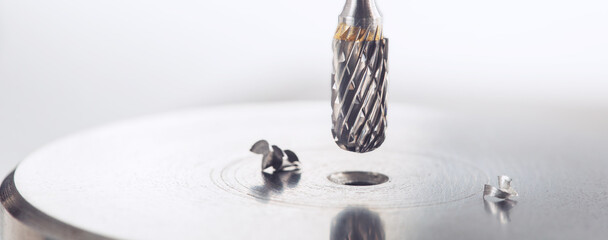 Milling сutter make sink in hole in steel billet. Locksmith work.