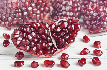 Garnet. Fruit of a juicy pomegranate in a cut.
