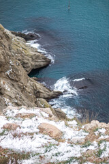 cliff in the snowy mountains by the sea. Black Sea.