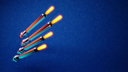 Four glow plugs on a snowy cold blue background. Shallow DOF; selective focus; 3d render