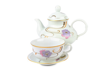 Ceramic teapot and a tea cup with ornament in classic style isolated on white background.