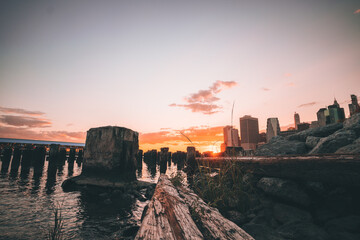 woods pier sky color orange clouds sun summer sunset new york city sea water 