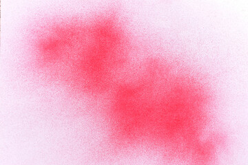 red spray paint on white paper background
