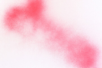 red spray paint on white paper background