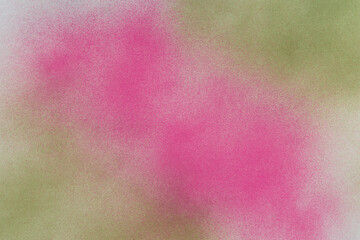 spray paint magenta and green on a white paper background