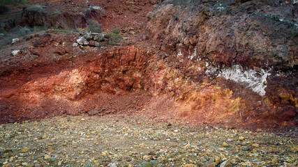 Colorful red rocks in mining area rich with iron and copper ore