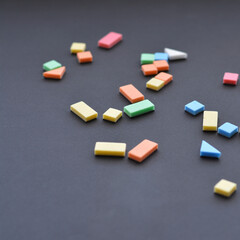 Education consept with copy space. Magmetic geometric puzzle pieces on black background.