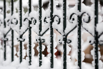 wrought iron grate in the snow