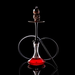 Hookah with a glass flask and a metal bowl shisha no smoke. Black background. Front view.
