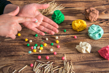 hands playing with Homemade plastiline