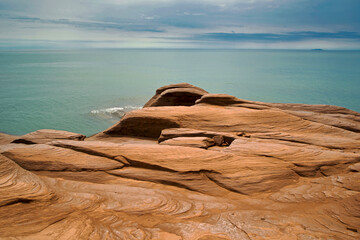Canada, Quebec, Iles-de-la-Madeleine. Red cliffs and ocean