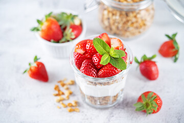 Strawberry Greek yogurt granola parfait in a glass
