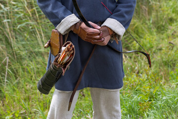 quiver and arrows on the belt bow in hand