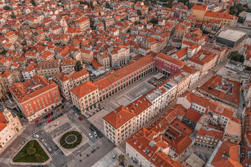 Fototapeta na wymiar Aerial drone shot of Republic Square in Split old town in sunrise hour in Croatia