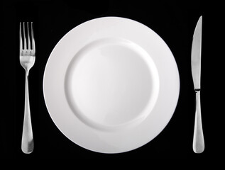 Plate a plug and a knife against a dark background