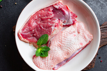 raw duck breast meat poultry and spices ingredient for cooking barbecue grill fresh portion on the table meal snack top view copy space for text food background rustic