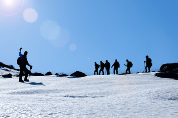 mountaineers immortalize their memories by photographing together at the summit