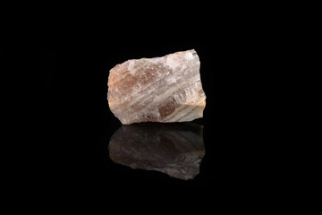 Natural mineral - Polychrome fluorite from Transbaikalia, Russia on black glass background.