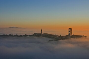 Sunset in the fog, Perugia, Italy 