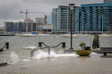 Waves churned up by a storm crash against Long Wharf in Boston